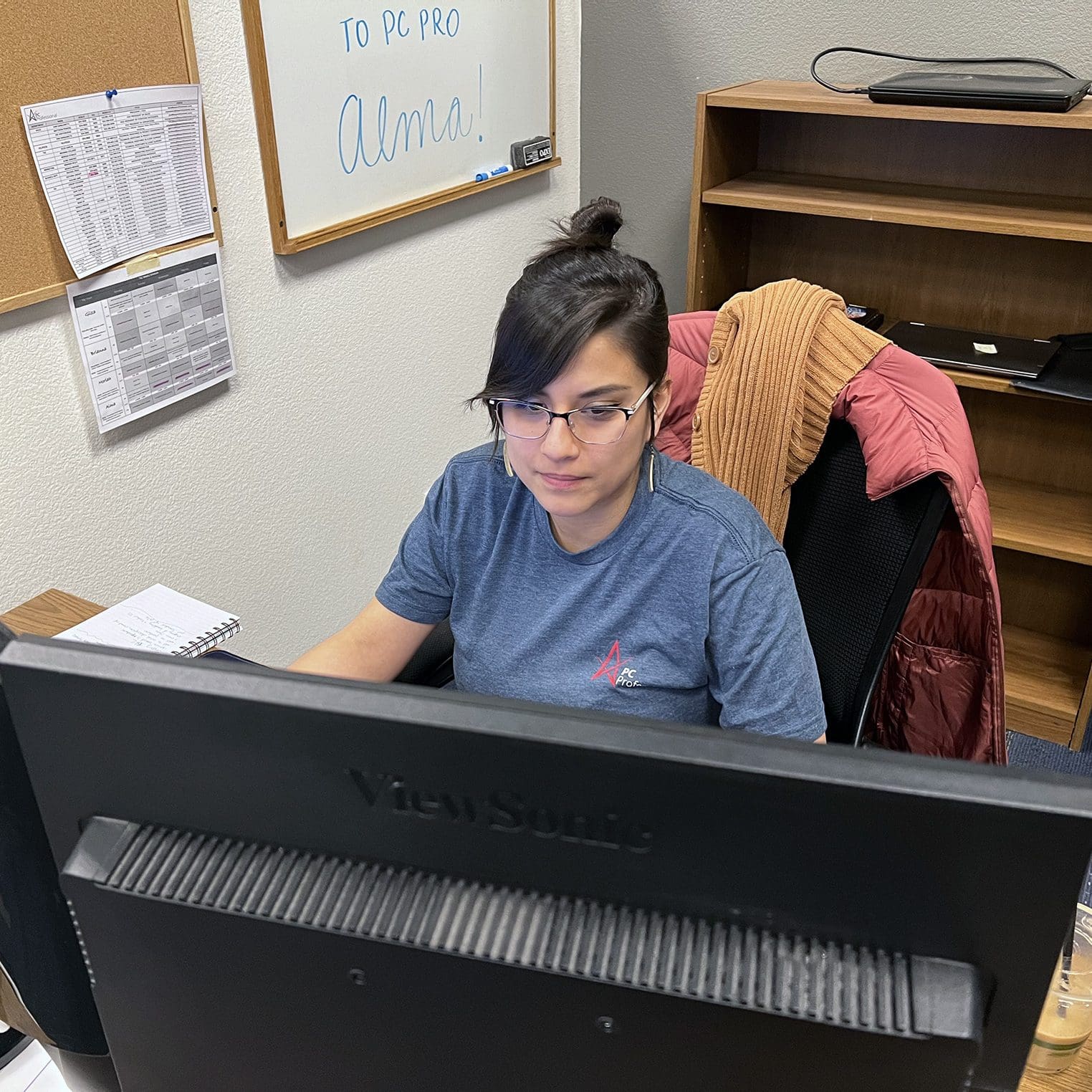 PC Professional team member working at a desktop computer