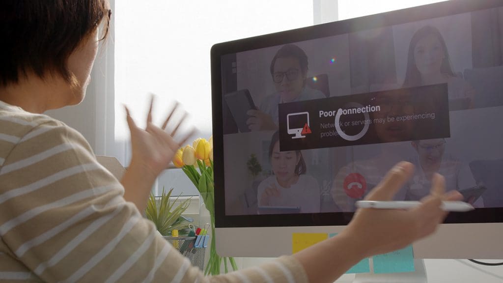 A person frustrated with the poor connection of her video call.